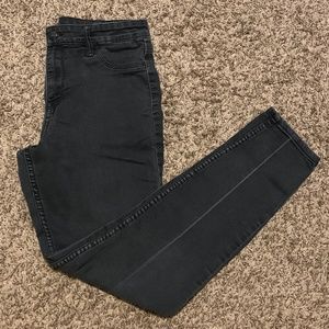 Women's size 28 regular waist faded black skinny jeans.
